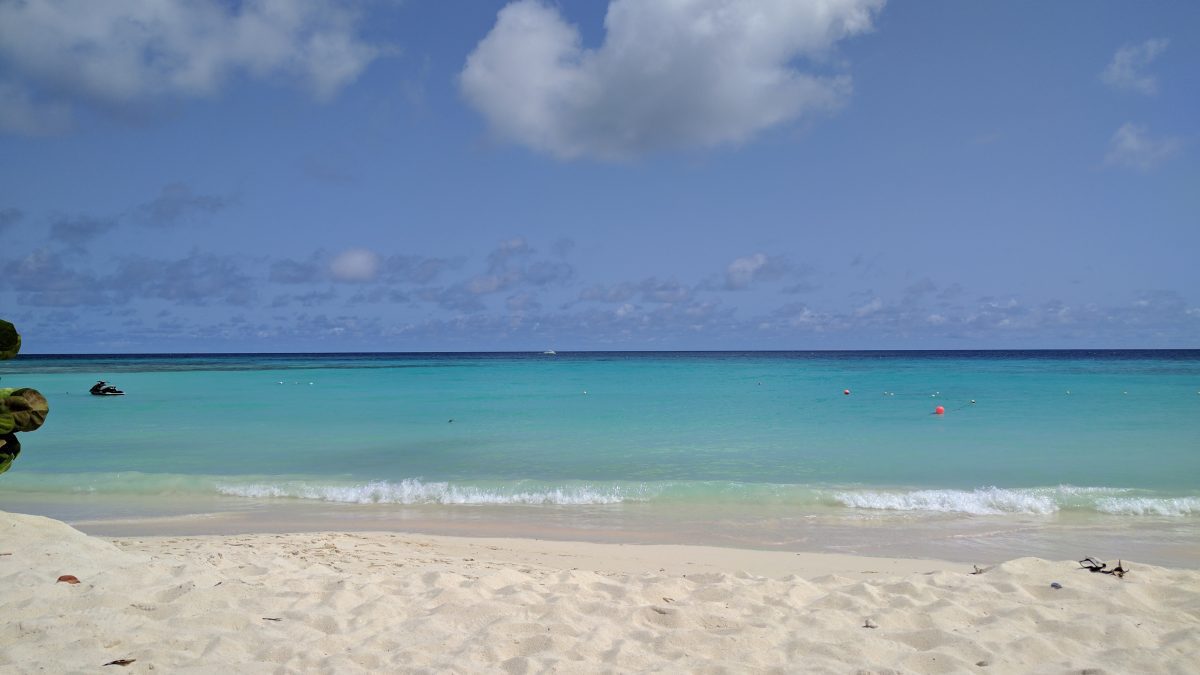Beautiful white sand beach with gently lapping waves